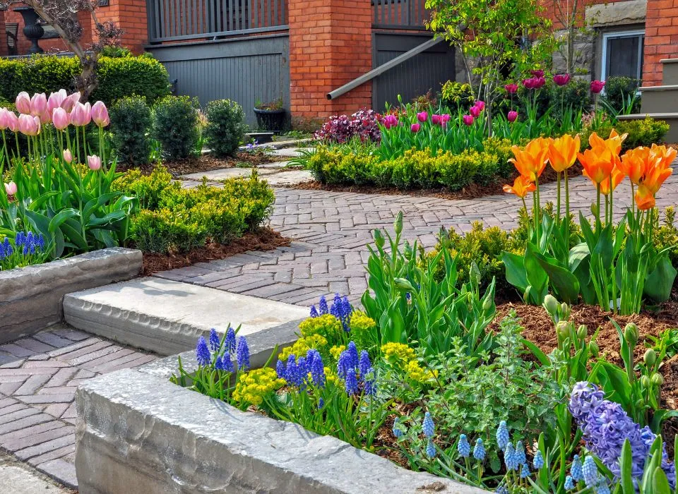 Beautifully curved flagstone walkway surrounded by professional landscaping in a Los Angeles home by Dream Patios LA.