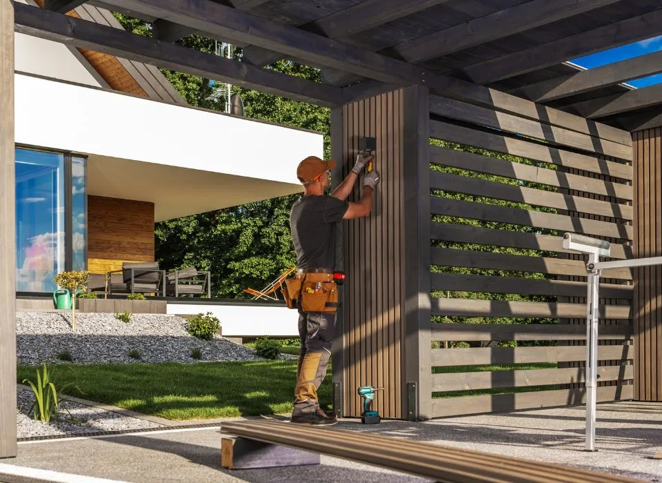 Custom curved stone sitting wall with integrated under-cap LED lighting in a Los Angeles backyard by Dream Patios LA.