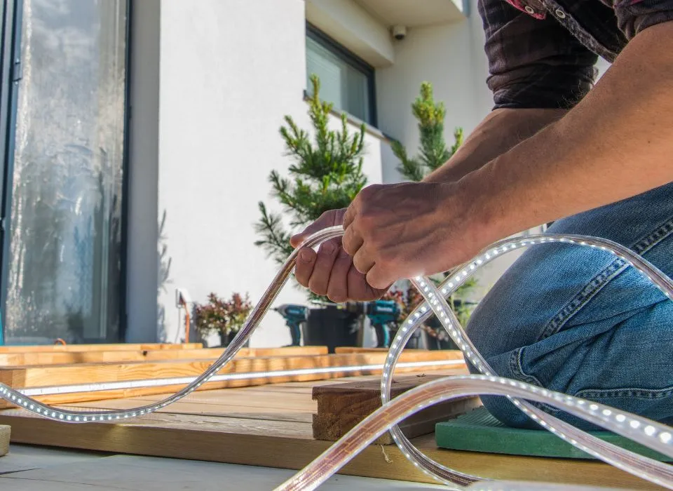 Cozy outdoor fire pit area surrounded by illuminated sitting walls for evening entertainment in Los Angeles by Dream Patios LA.